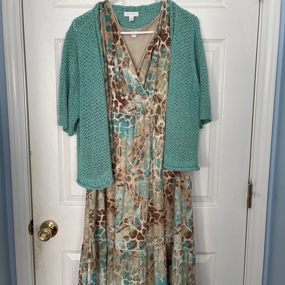 Sleeveless dress with matching crocheted jacket.